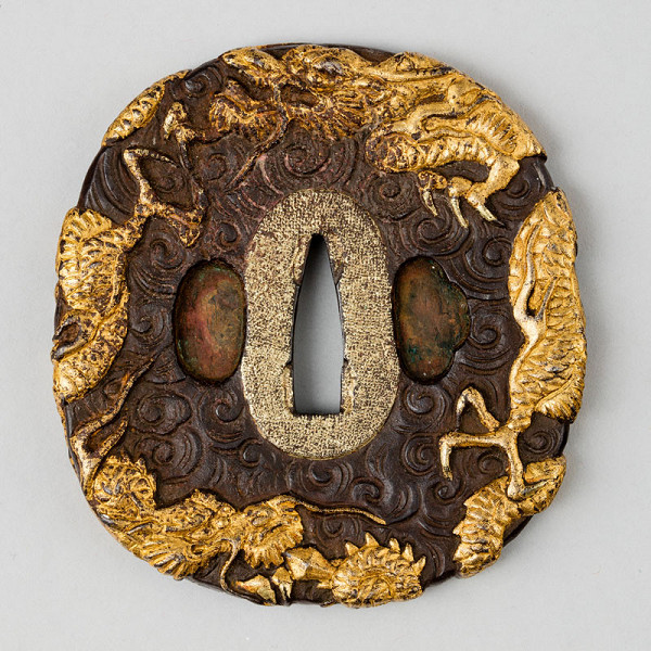 Anonymous artist - Tsuba (sword guard) decorated with a three-clawed dragon in clouds 